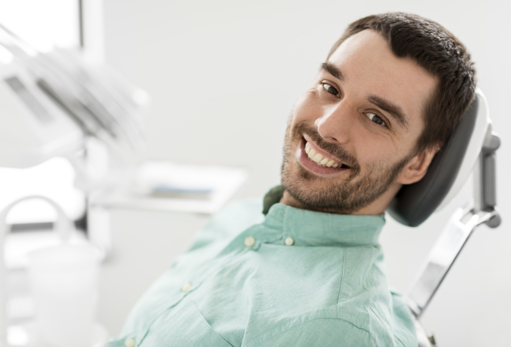man sitting in a dental chair
