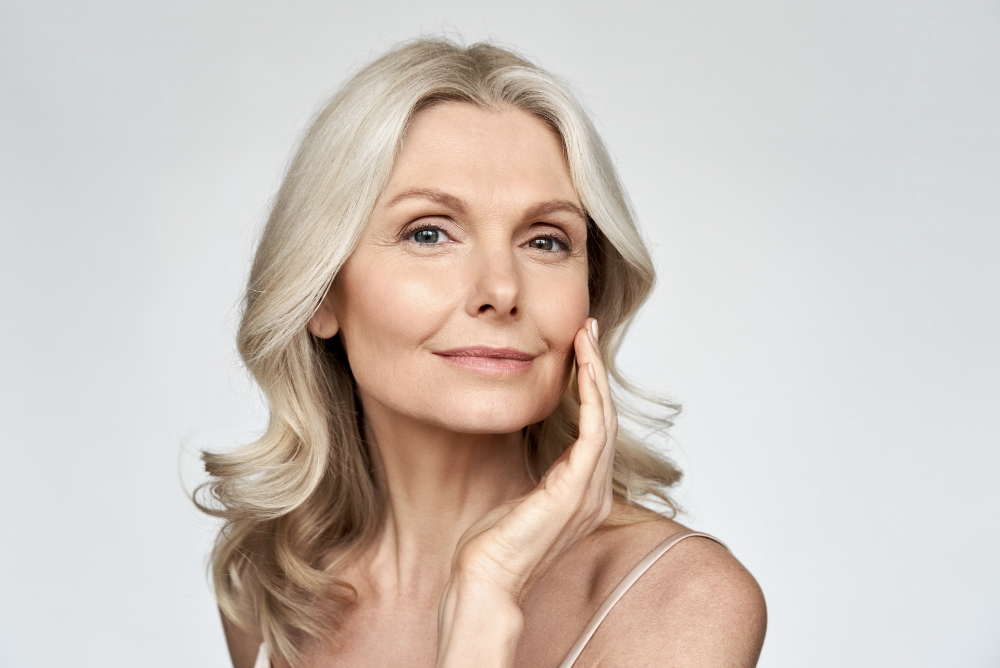 woman touching her left cheek