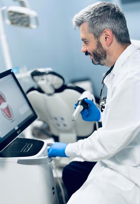 dentist working with cerec technology